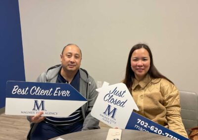 couple holding a sign saying best client ever